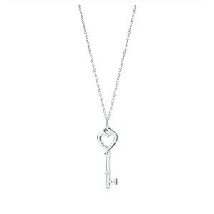 Heart key charm in sterling silver. Sterling Silver, 18in Chain.